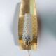 Vintage glass wall sconce from the 1960s in brass, mid-century light.