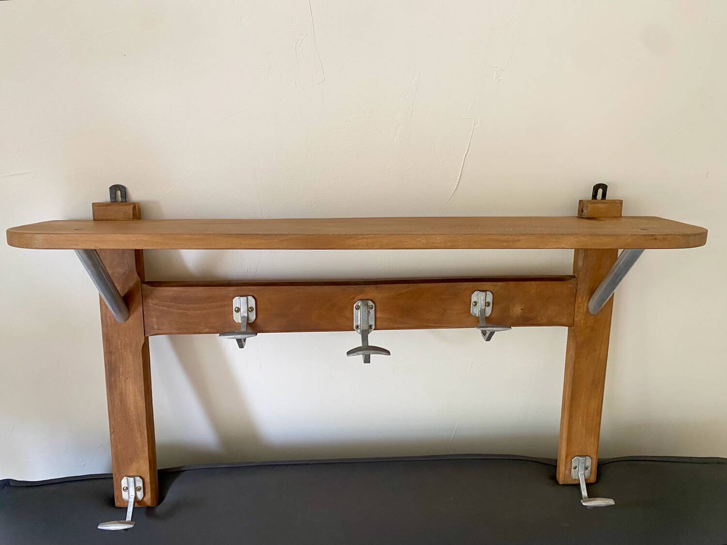 Wall-mounted coat rack with vintage hooks