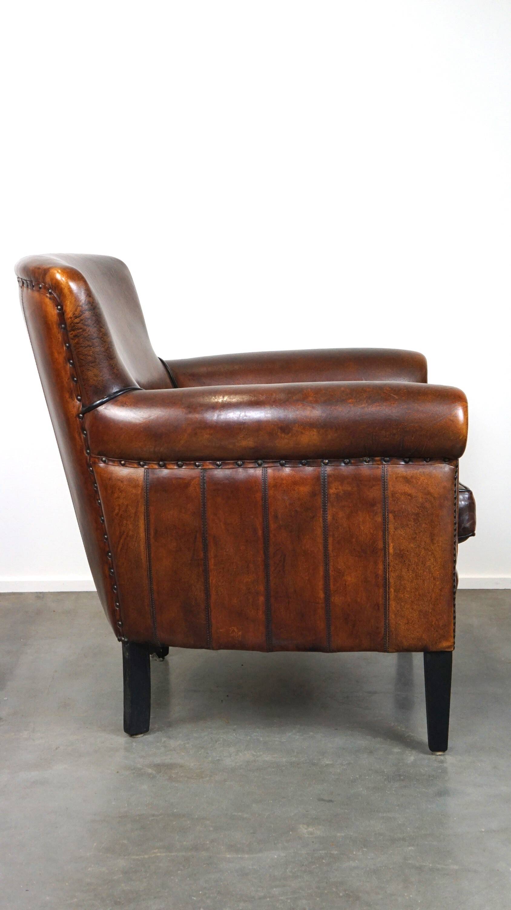 Stylish sheepskin leather armchair with a refined appearance