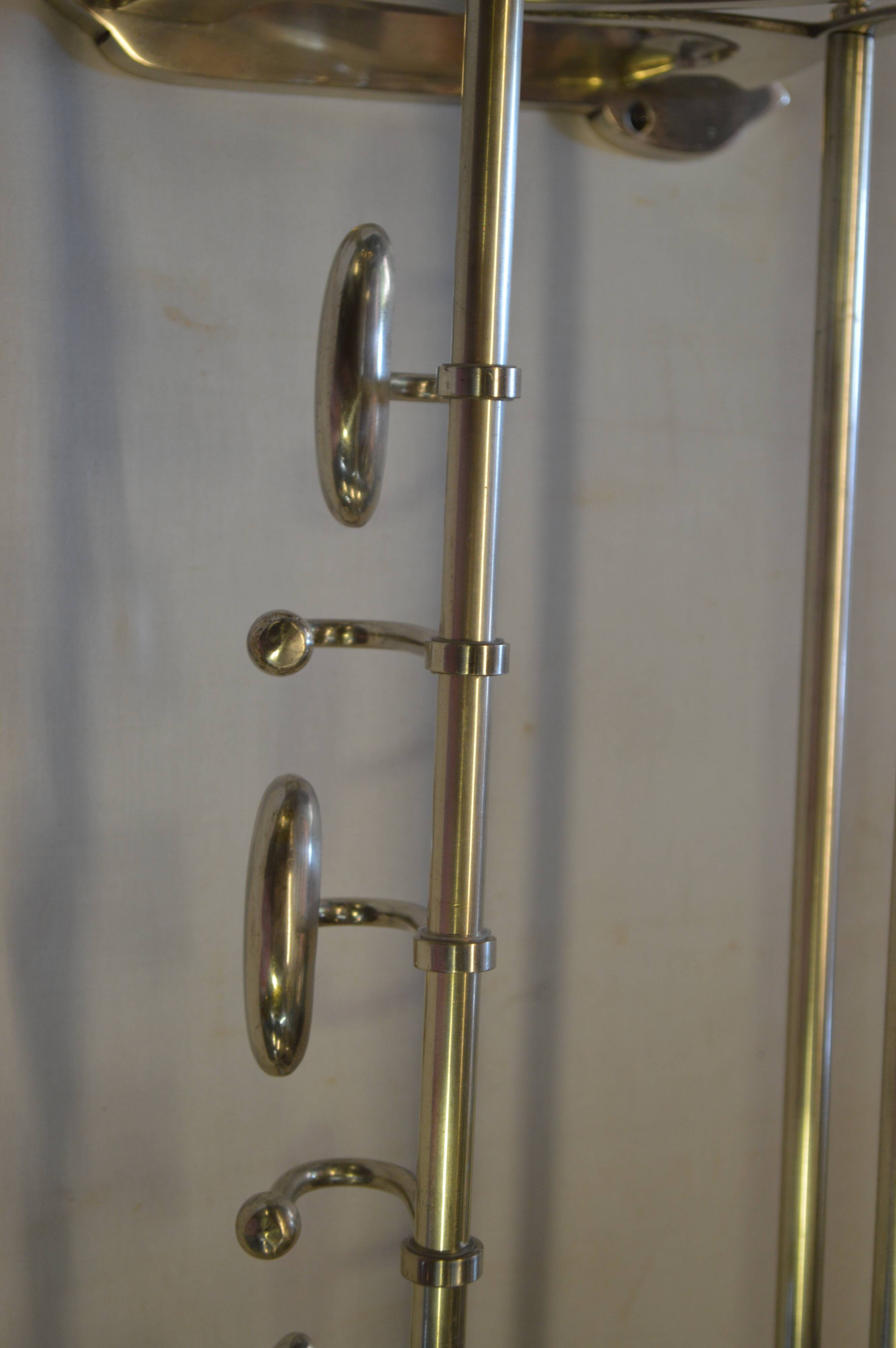 Chrome iron coat holder with a hat holder