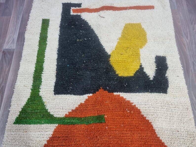 Handmade traditional Moroccan rug with colourful patterns, size 140x260 cm.