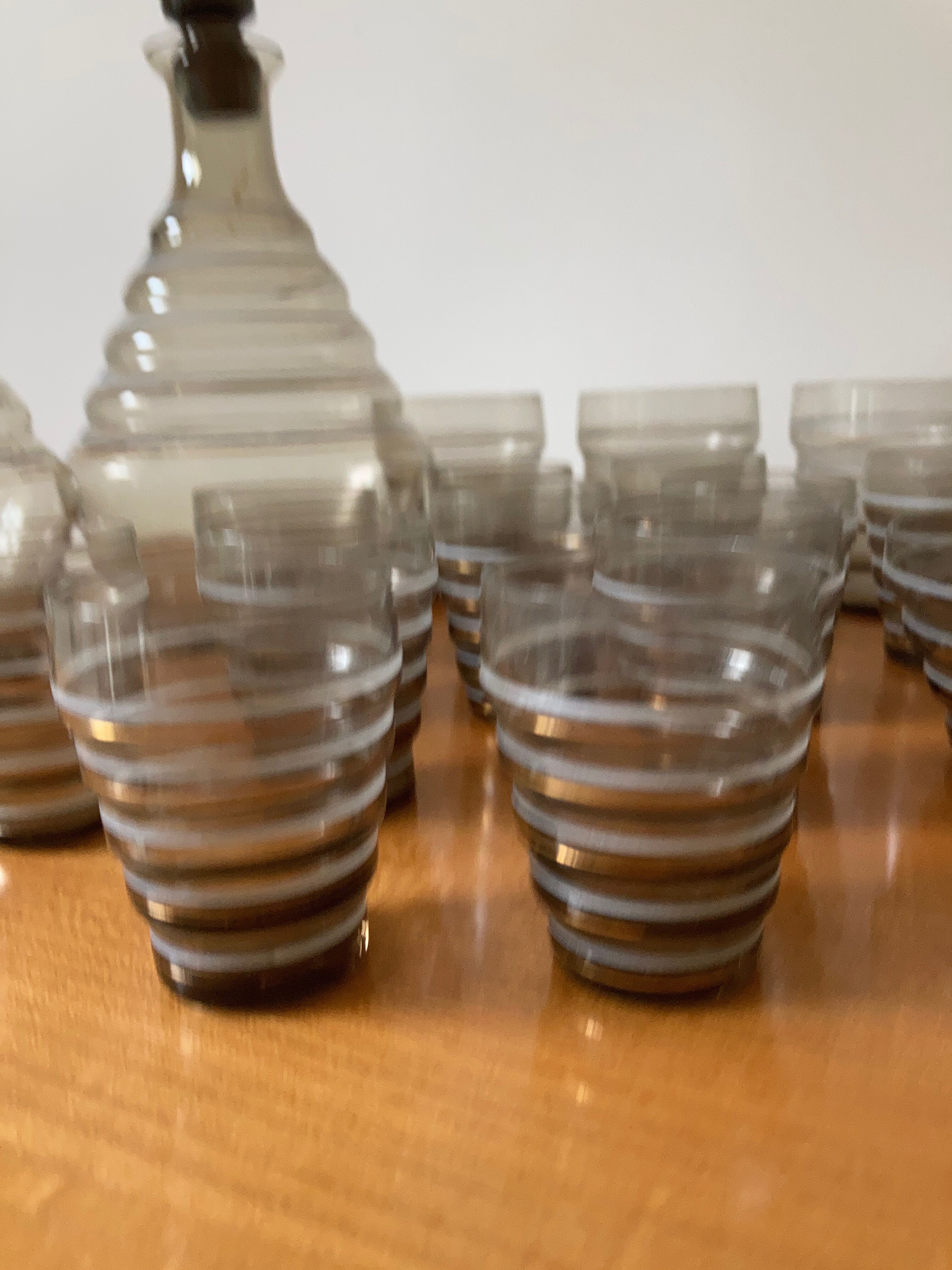 Service of glasses, cups, decanters of the 50s in smoked glass