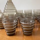 Service of glasses, cups, decanters of the 50s in smoked glass