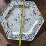 Ancient hexagonal plate in earthenware with polychrome floral decoration.