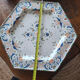 Ancient hexagonal plate in earthenware with polychrome floral decoration.