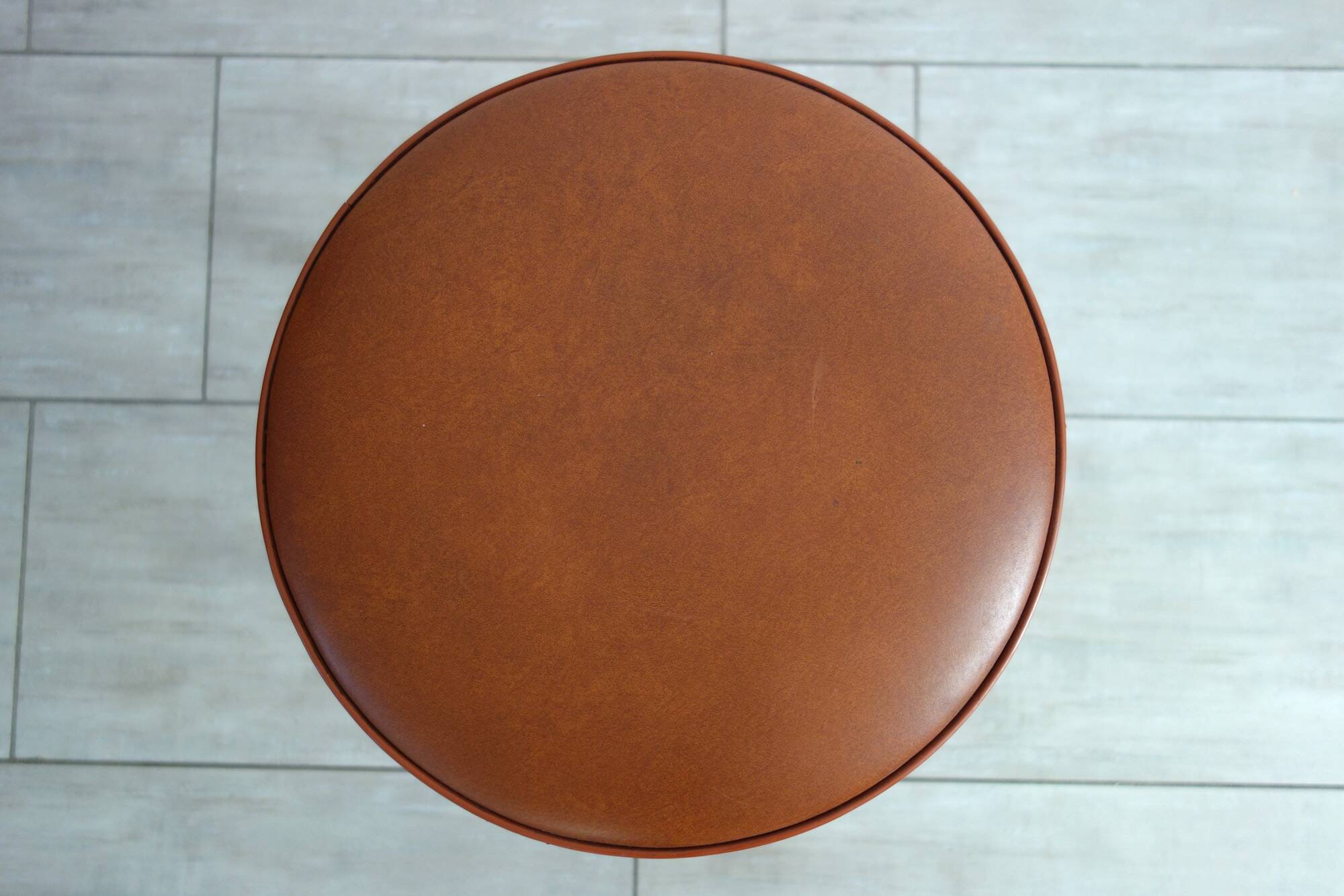 Baumann low stool from the 60s in brown leatherette