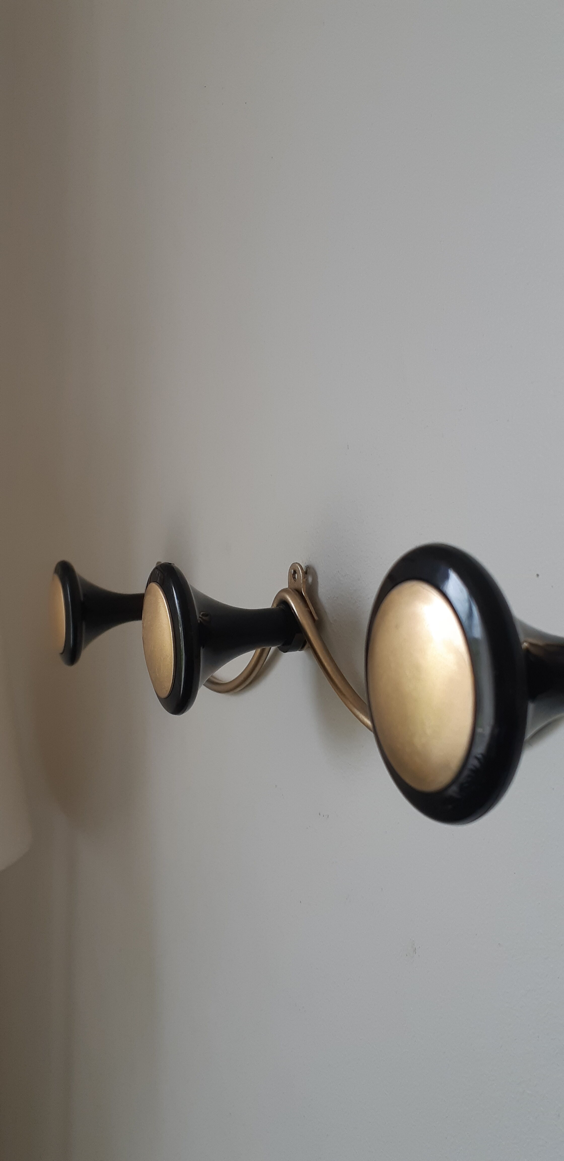 Vintage coat rack in gilded metal and bakelite
