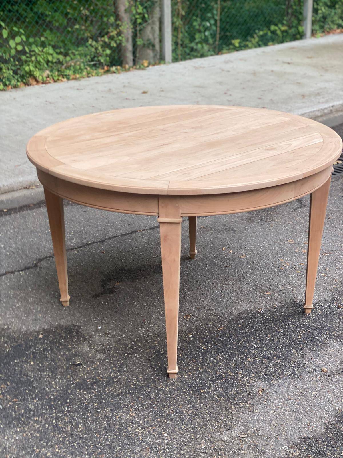 Round extendable dining table stripped in cherry wood Louis XVI René Trotel 1