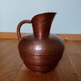 Dented copper vase or jug
