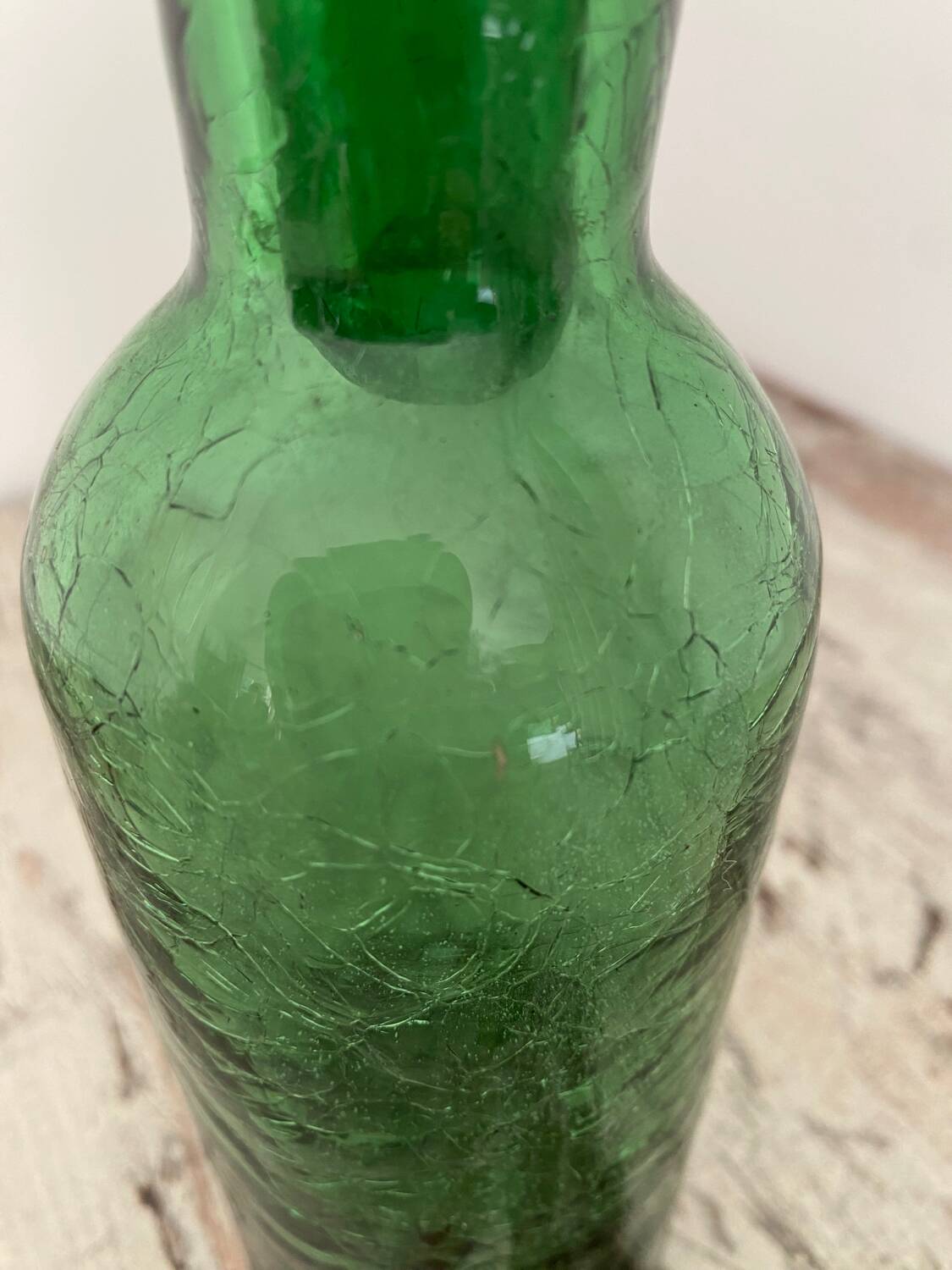 Old cracked glass carafe