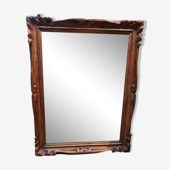 Mirror in golden wood