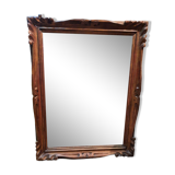 Mirror in golden wood