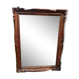 Mirror in golden wood