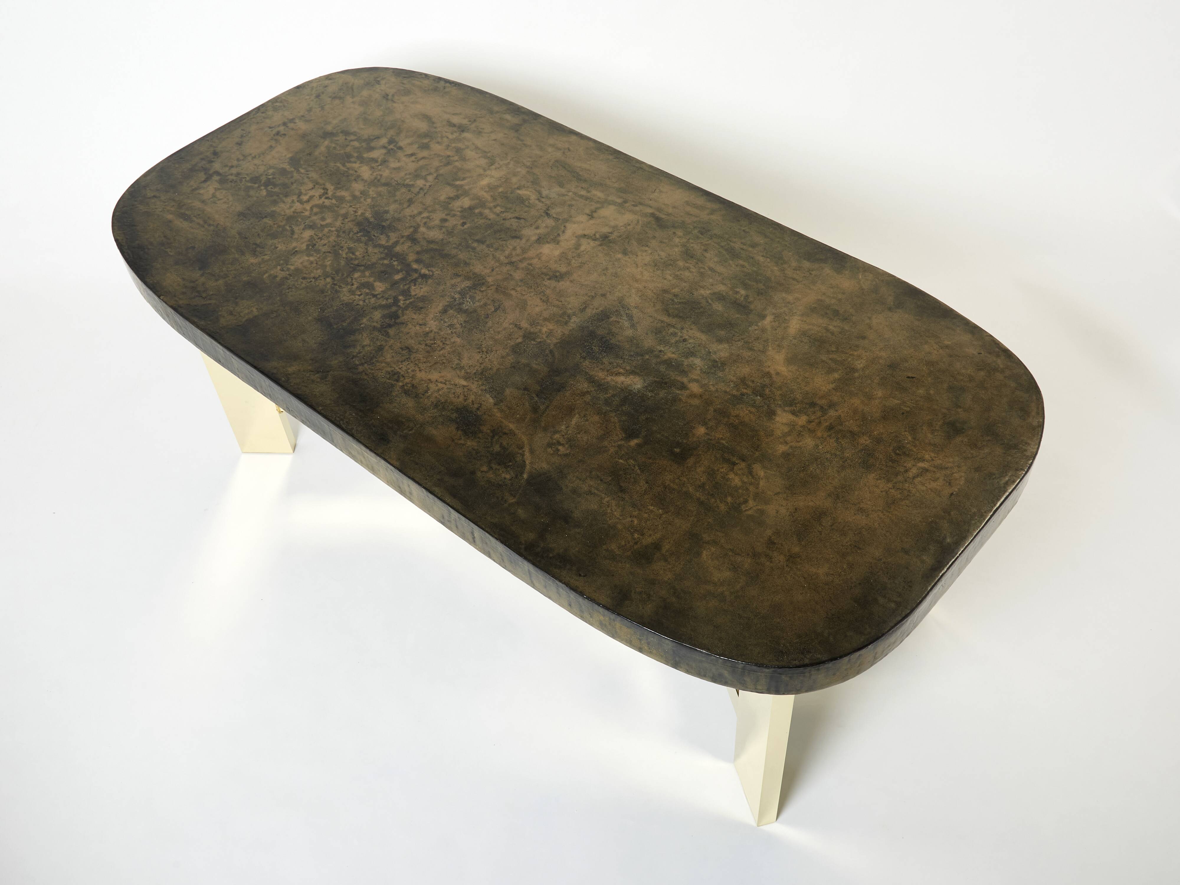 Brutalist Belgian dining table in resin and brass from around 1970.