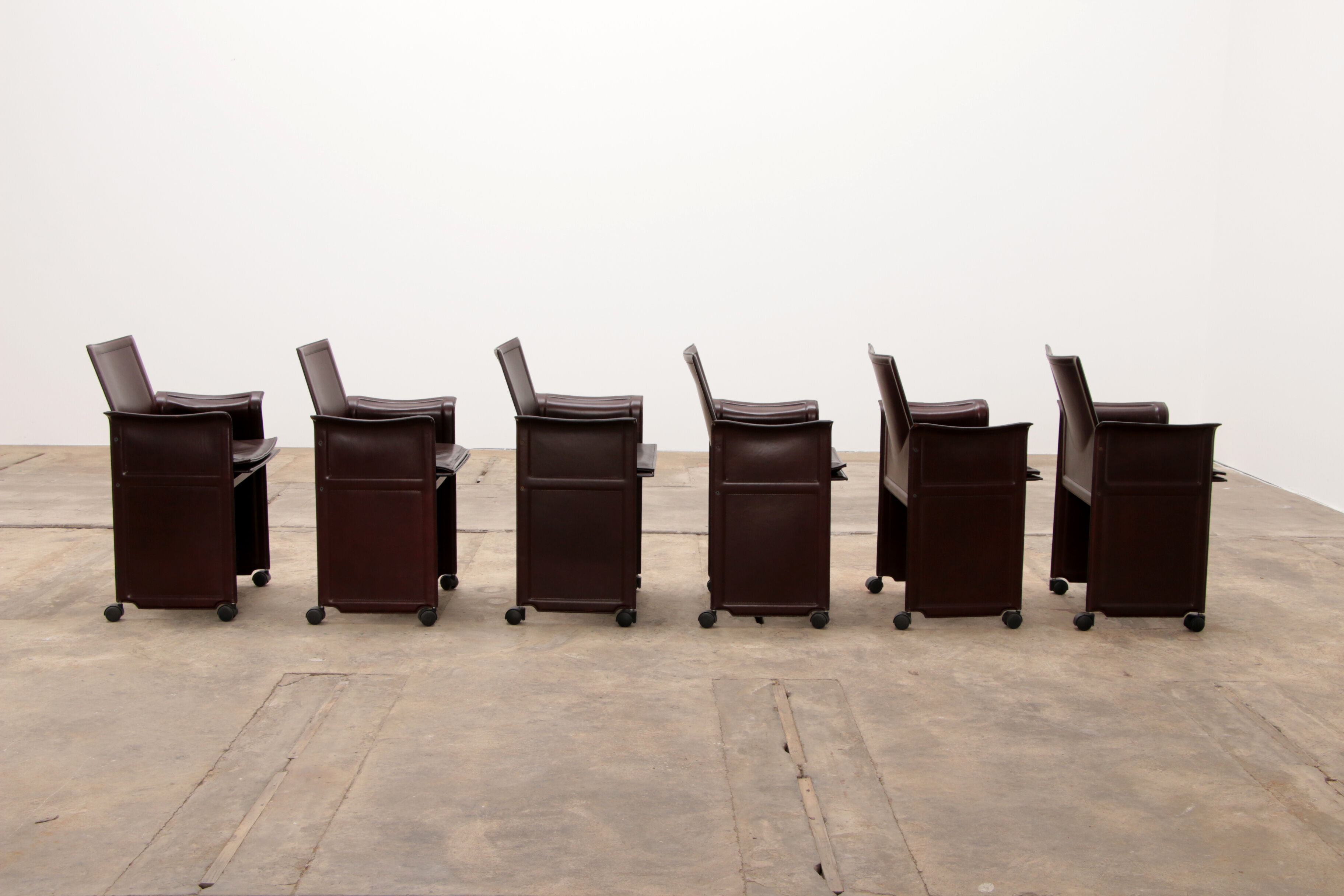 Tito Agnoli for Matteo Grassi leather dining table and six chairs