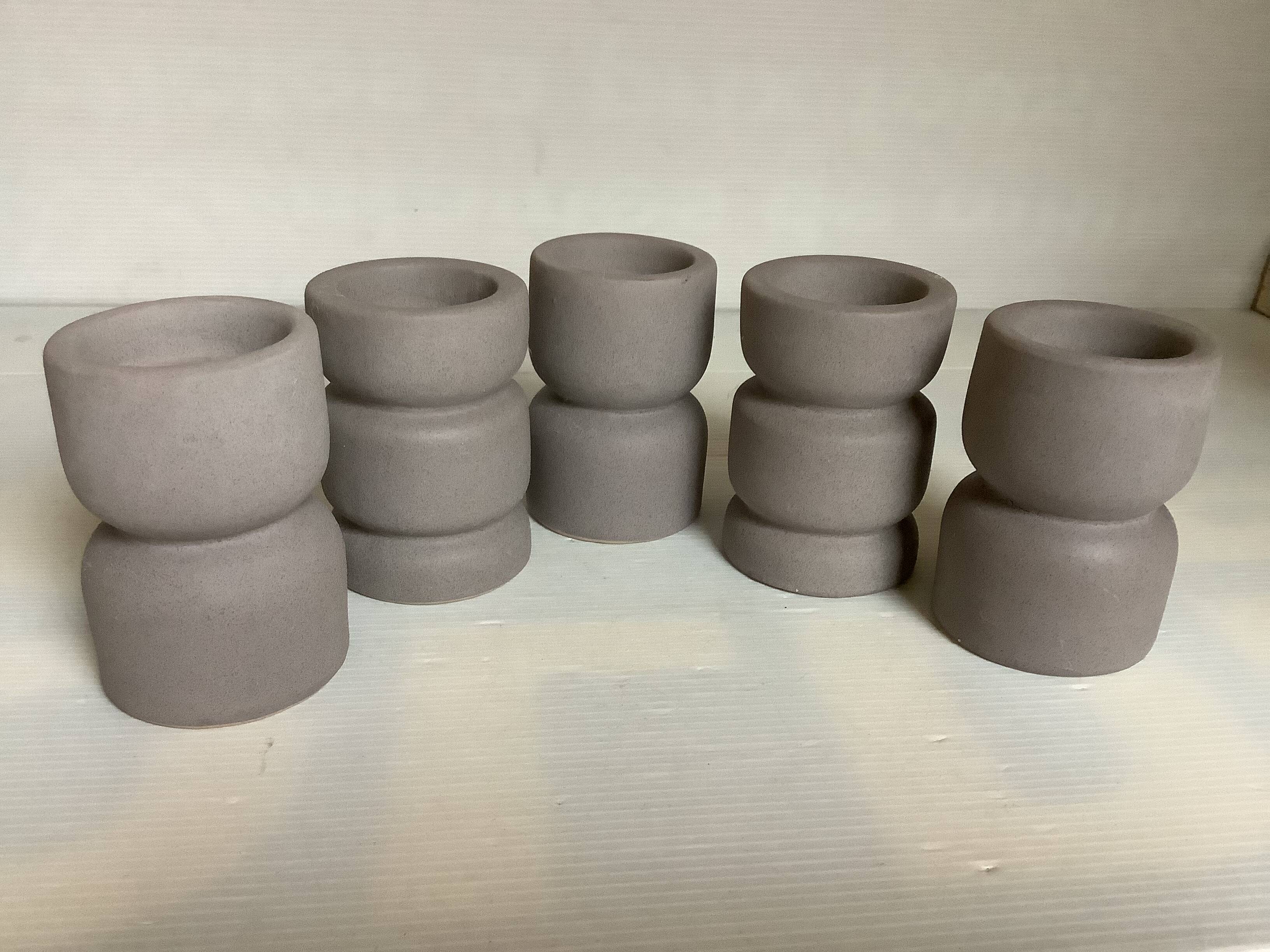 Five matte gray candle holders