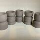 Five matte gray candle holders