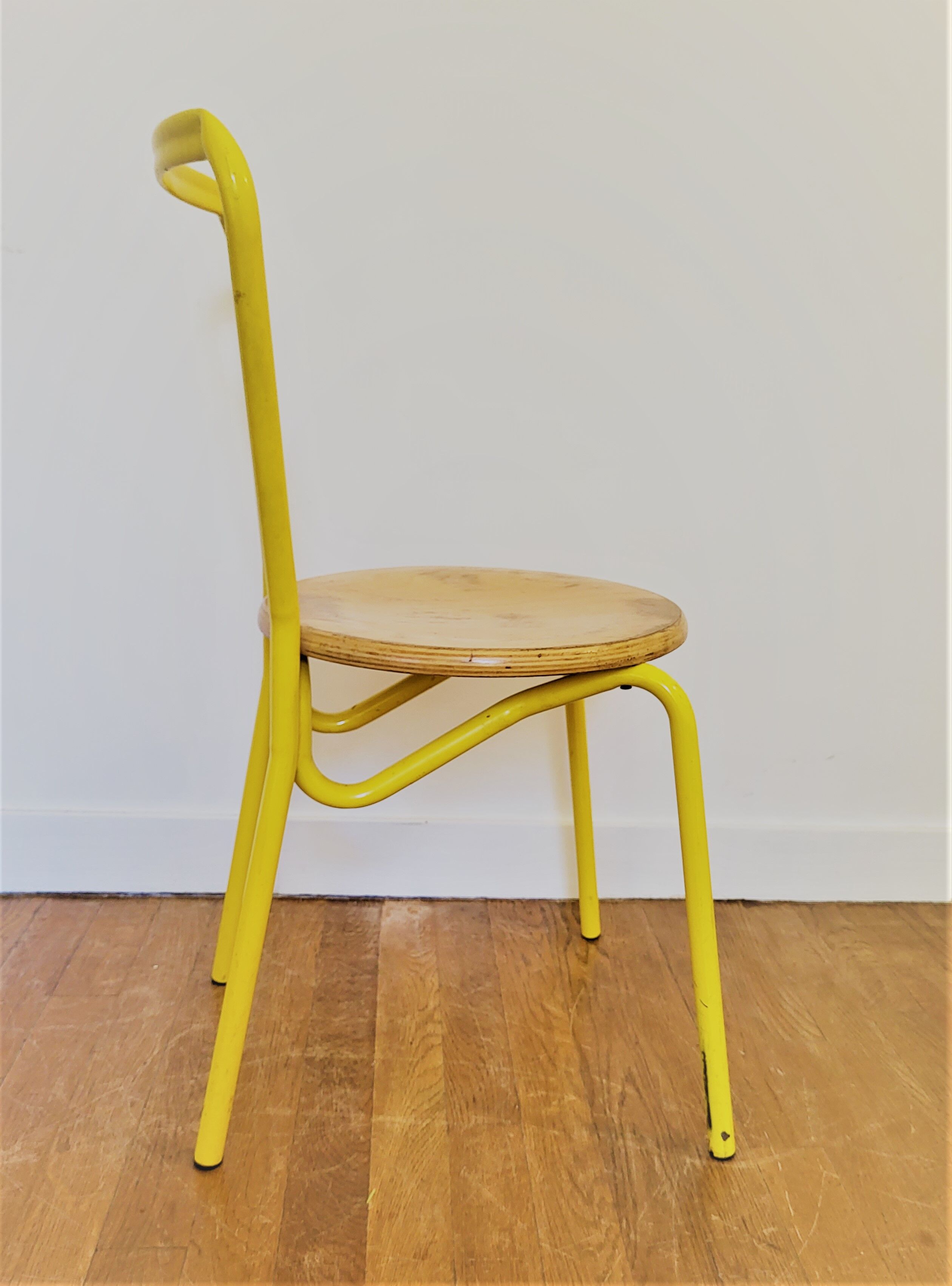 Vintage yellow school chairs from the 90s