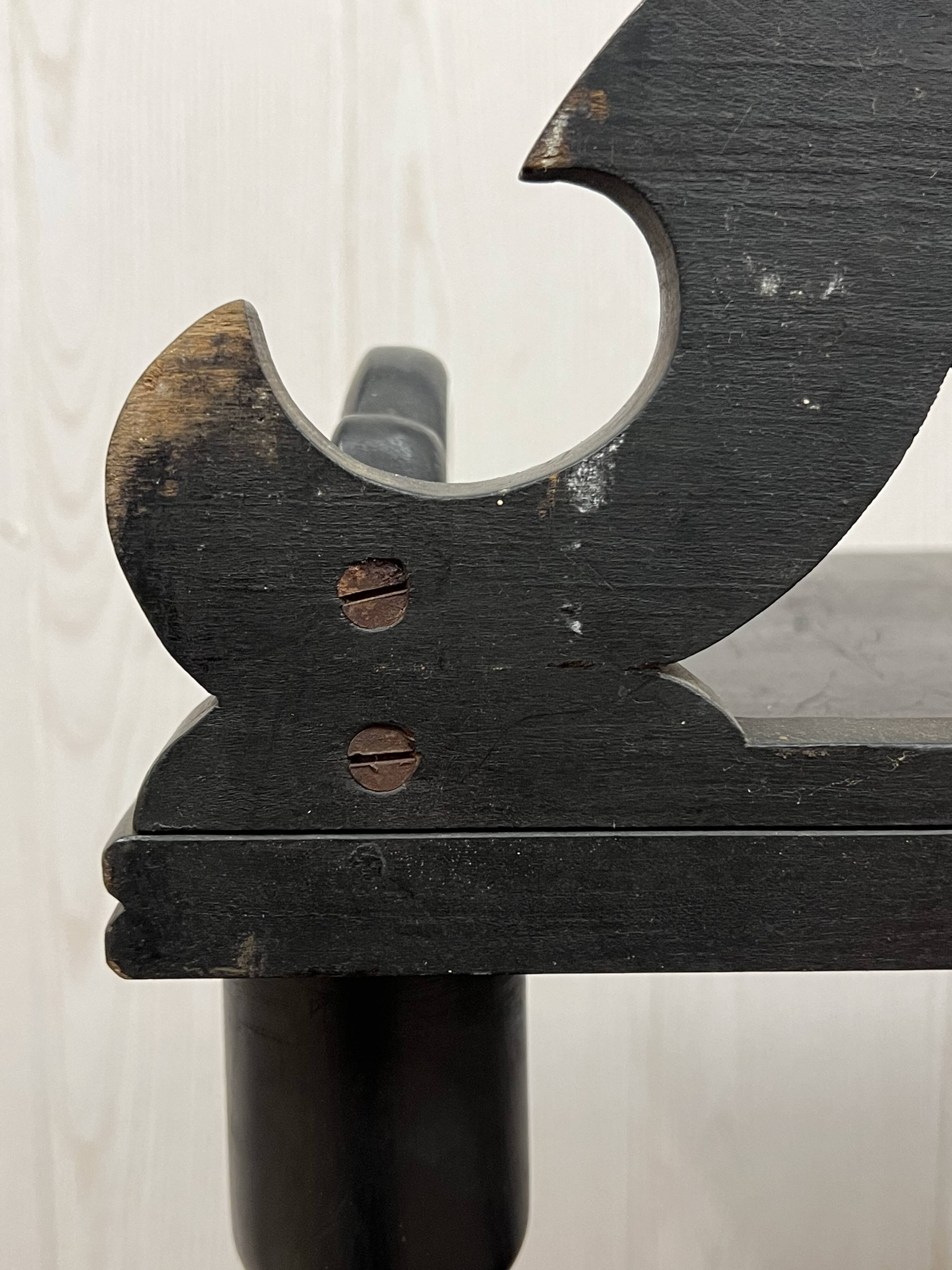 Blackened wooden shelf.