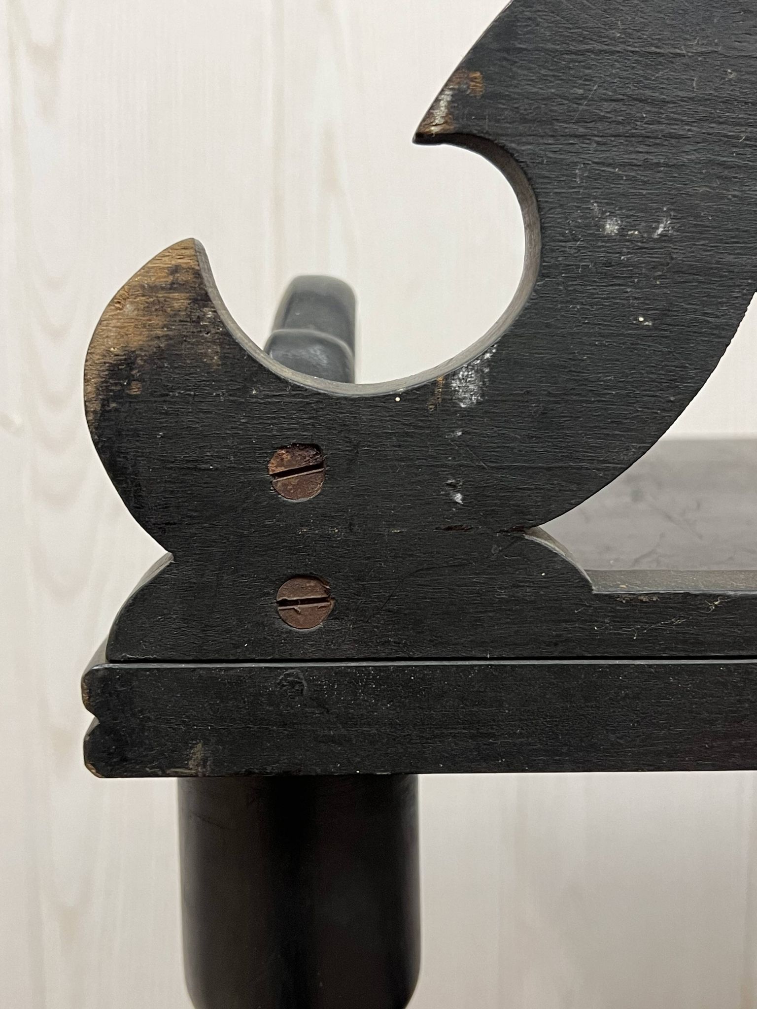 Blackened wooden shelf.