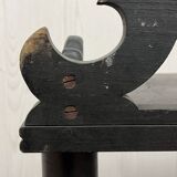 Blackened wooden shelf.