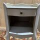 Pair of white Louis XV style bedside tables.