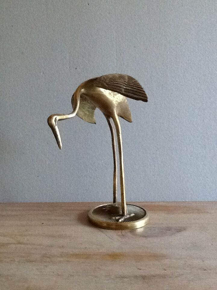 Bird takes off brass