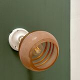 Vintage globe wall light in frosted pink and gold glass.