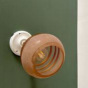 Vintage globe wall light in frosted pink and gold glass.