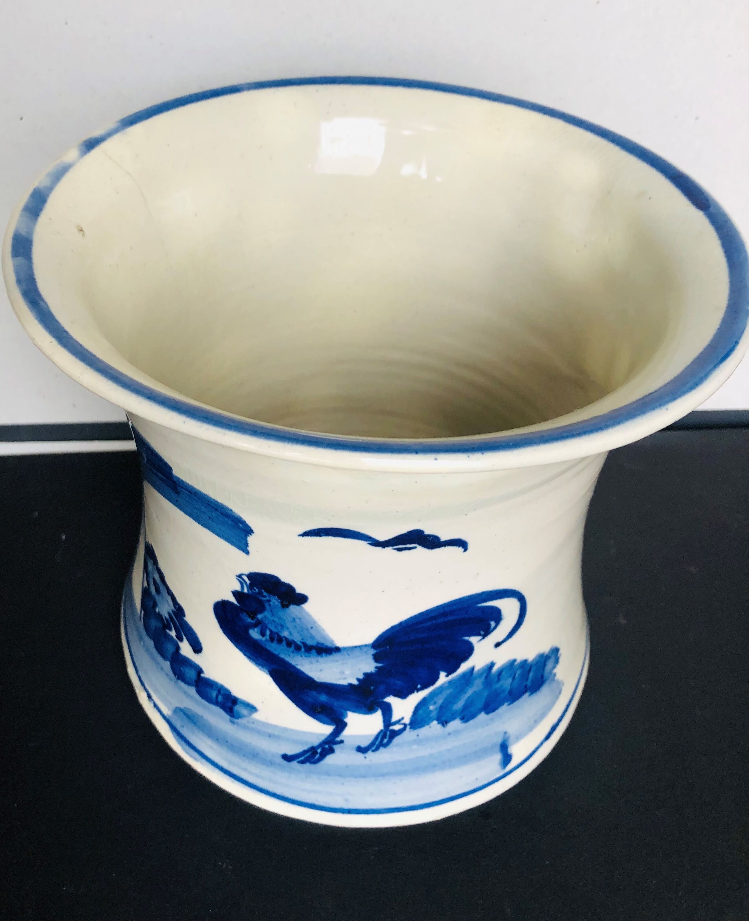 Old white blue ceramic pot cover