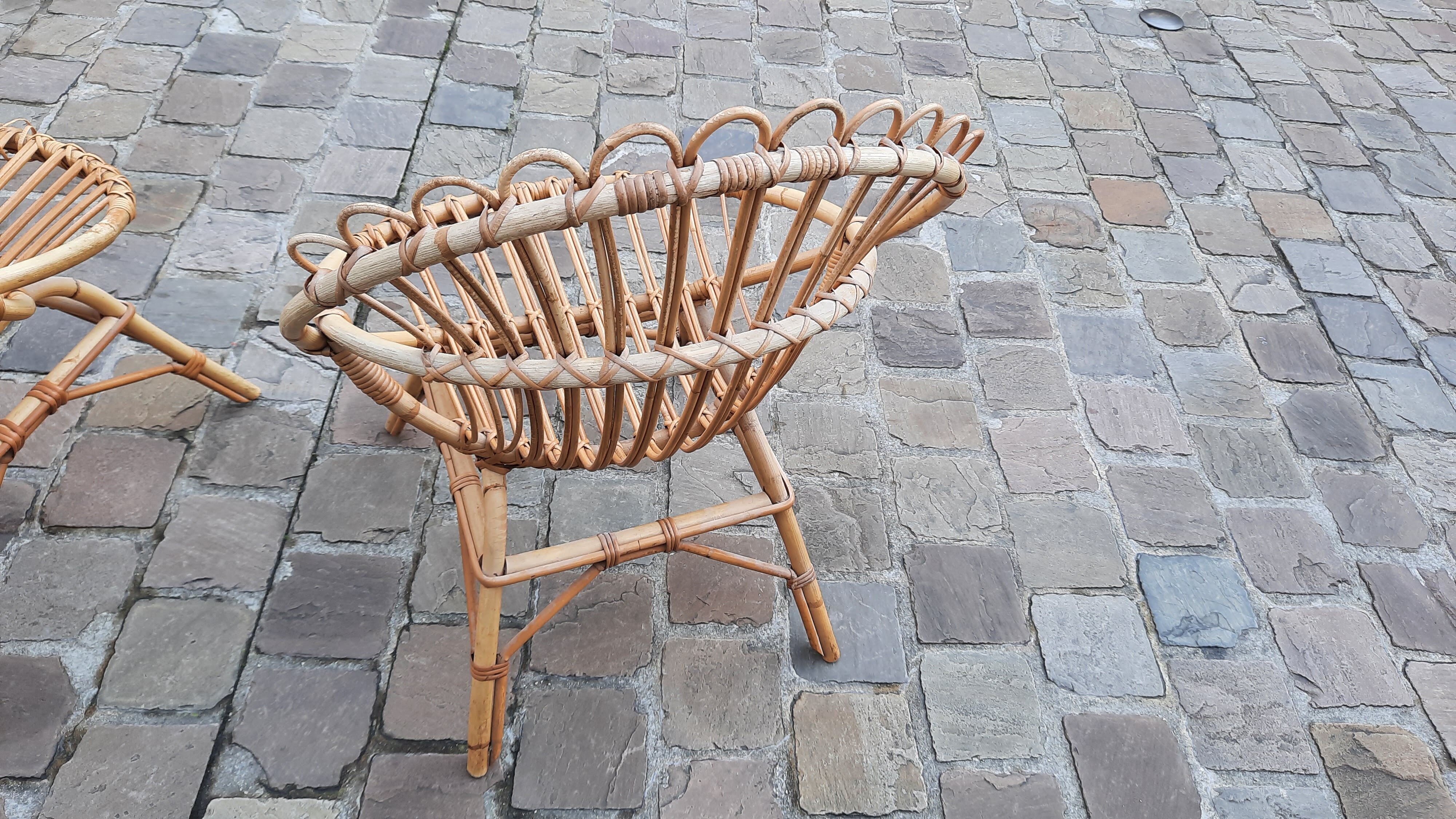 Pairs of shell rattan armchairs from the 50