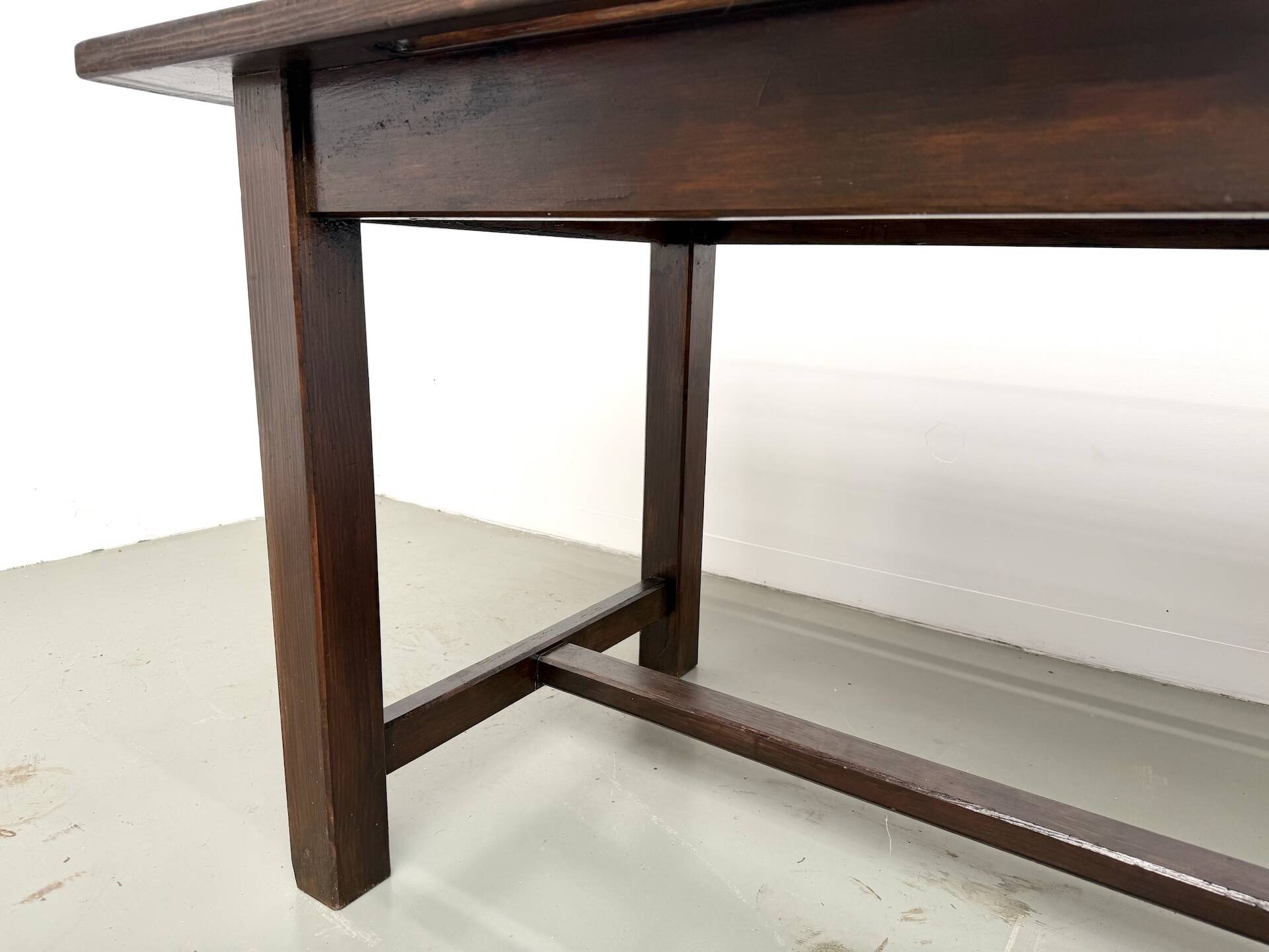 Solid pine workbench, grooved top, satin brown finish.