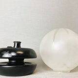 Small black wooden table lamp with frosted glass globe