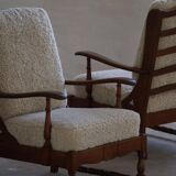Modern Danish design, a pair of high-backed armchairs in oak and lambswool, 1950s.