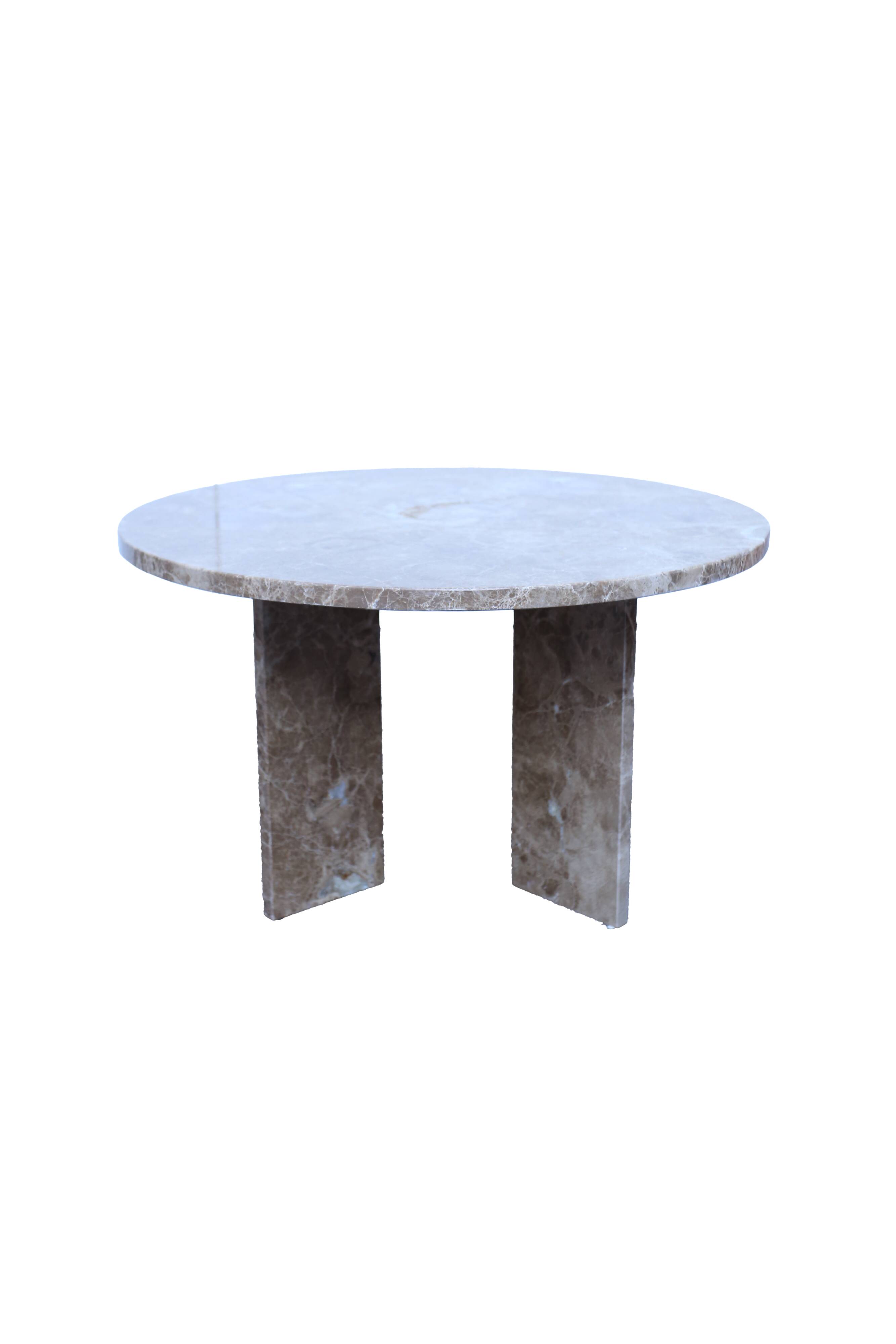 Round table in beige marble