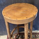 High curved wooden stool