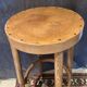 High curved wooden stool