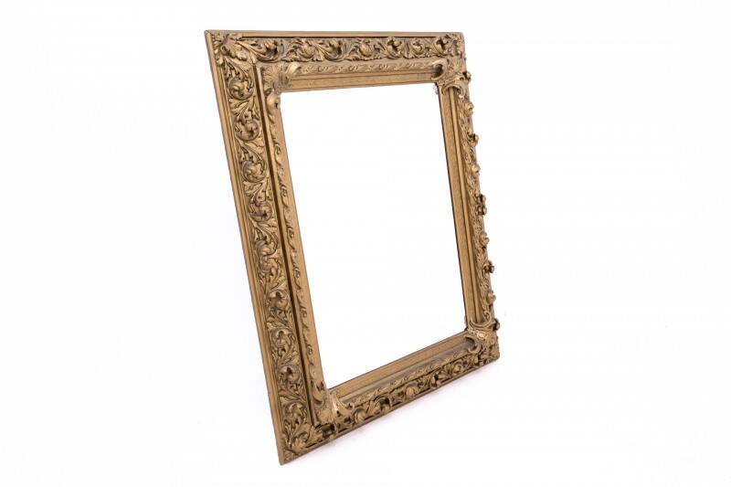 Antique mirror in richly decorated frame, France.