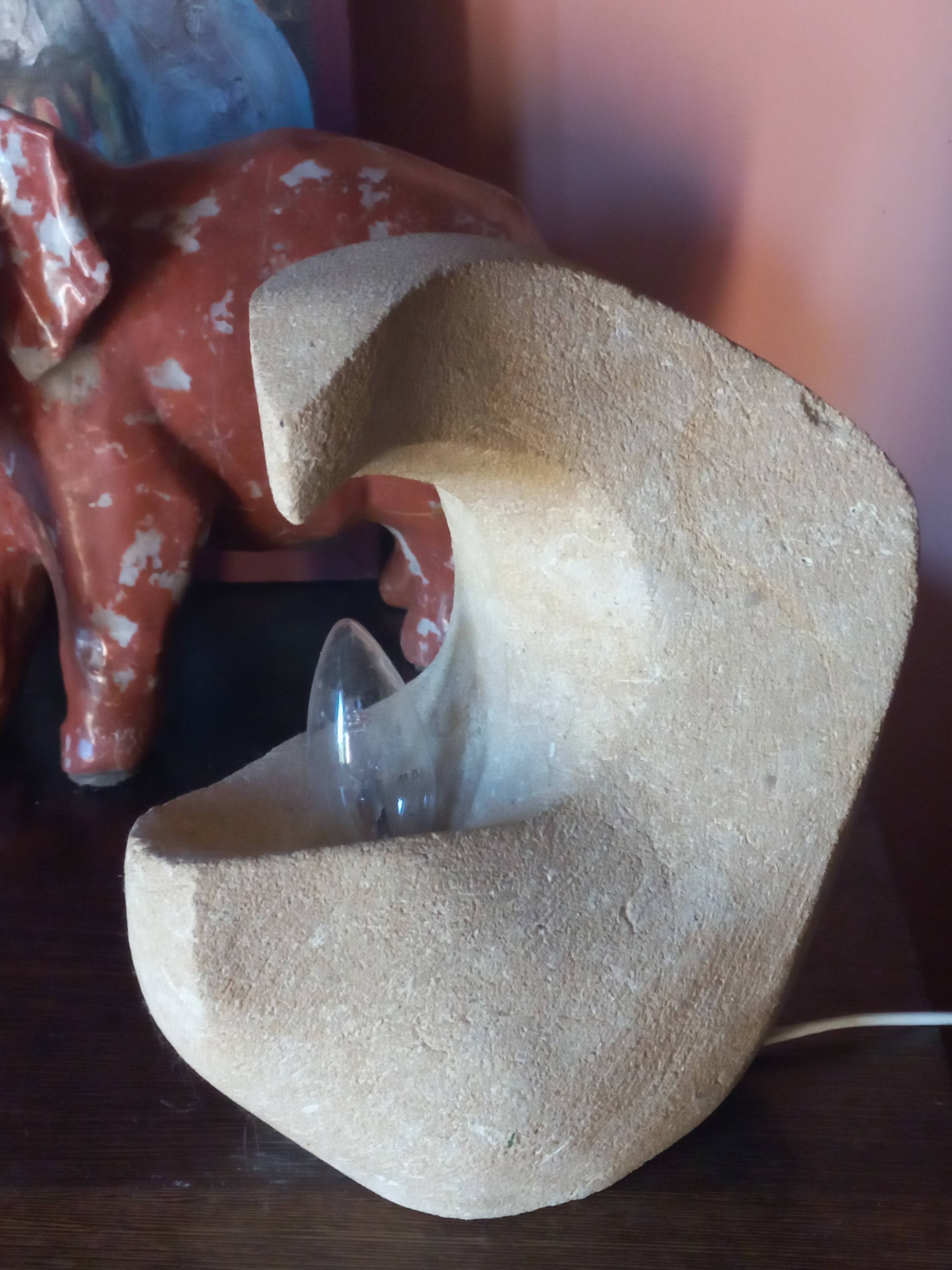 Sculpted stone lamp from the 1970s, signed.