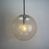 Large suspended lamp with a glass globe featuring bubbles by Peill & Putzler 1970.