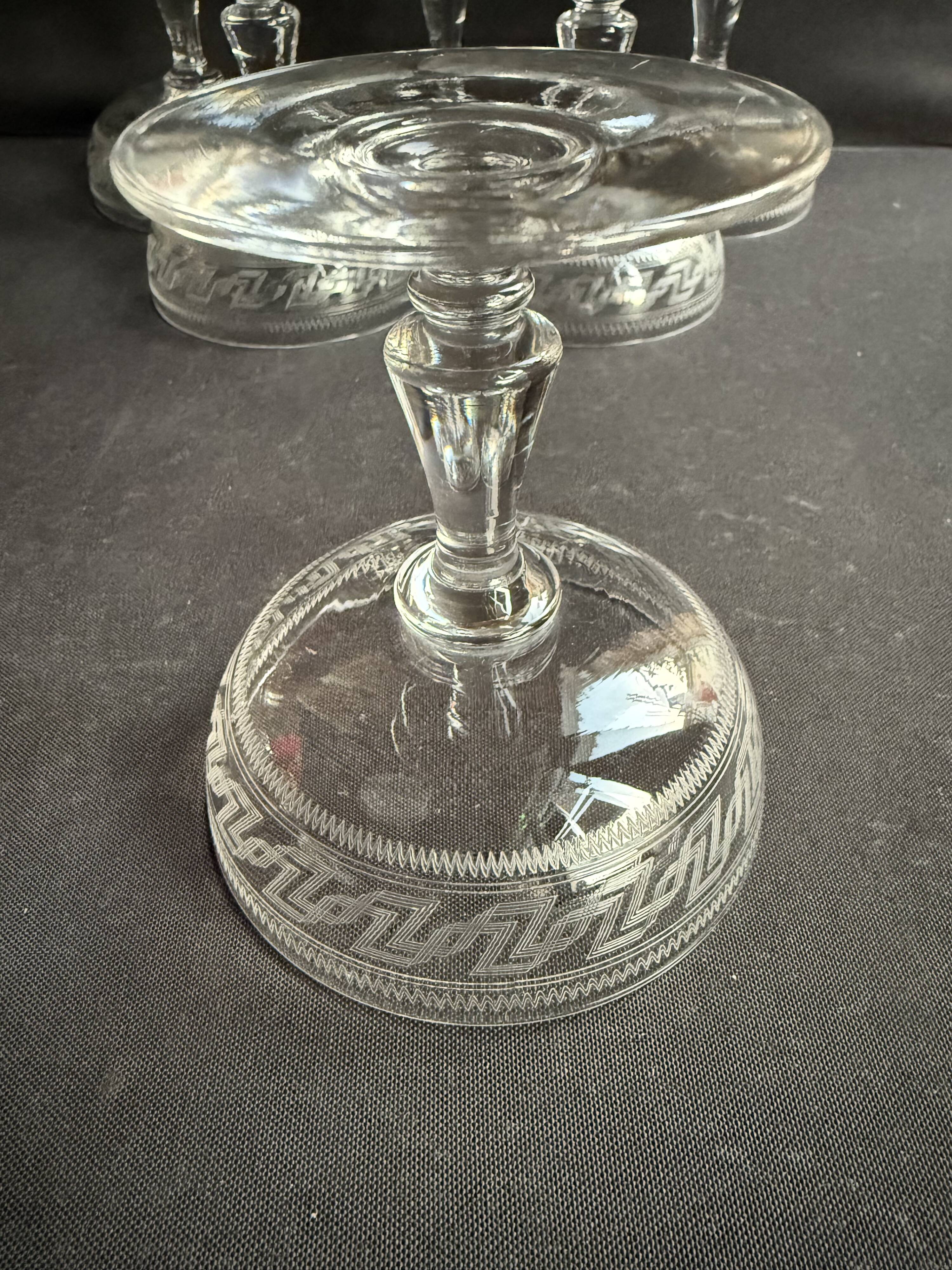 6 Baccarat champagne coupes with Greek engraving, slanted.
