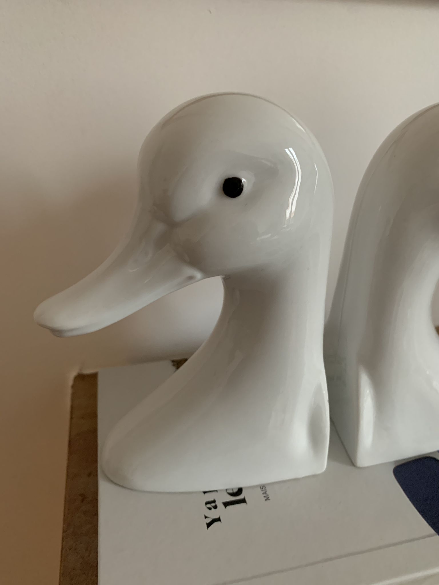 Vintage bookends in the shape of a goose or ceramic duck