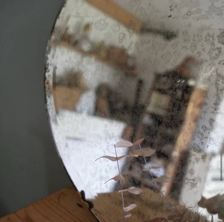 Antique oval bevelled mirror