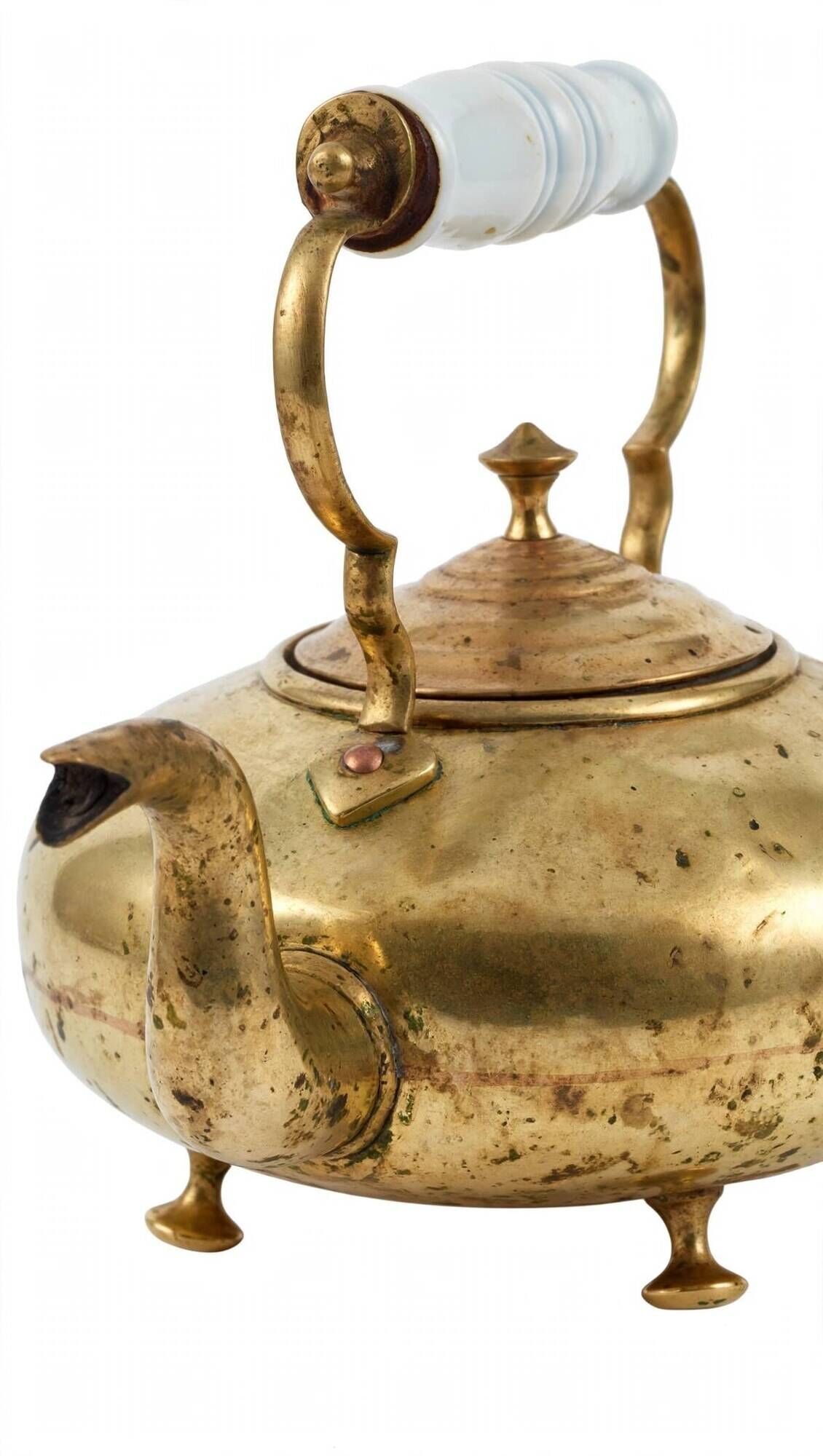 Victorian tripod kettle made of brass with a porcelain handle.