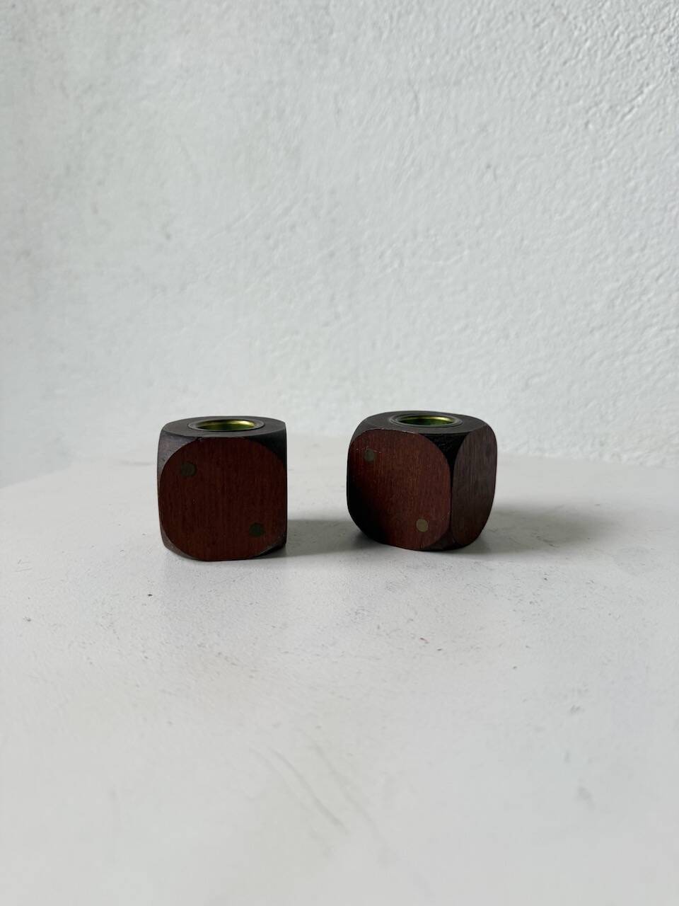 Pair of 1960s teak and brass "dice" candlesticks