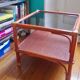 Varnished rattan coffee table and smoked glass top