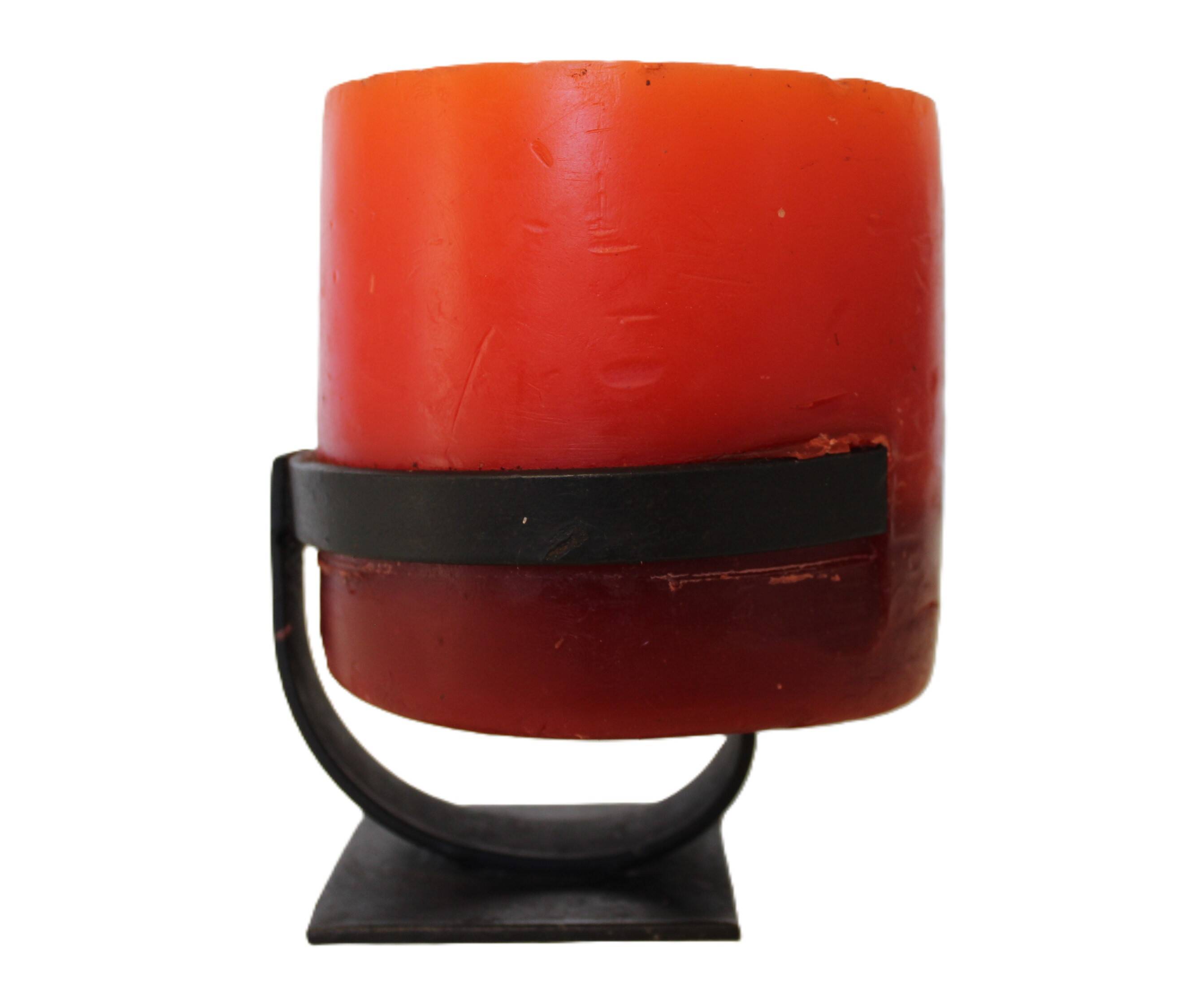 1970 wrought iron candlestick with its period coloured candle.