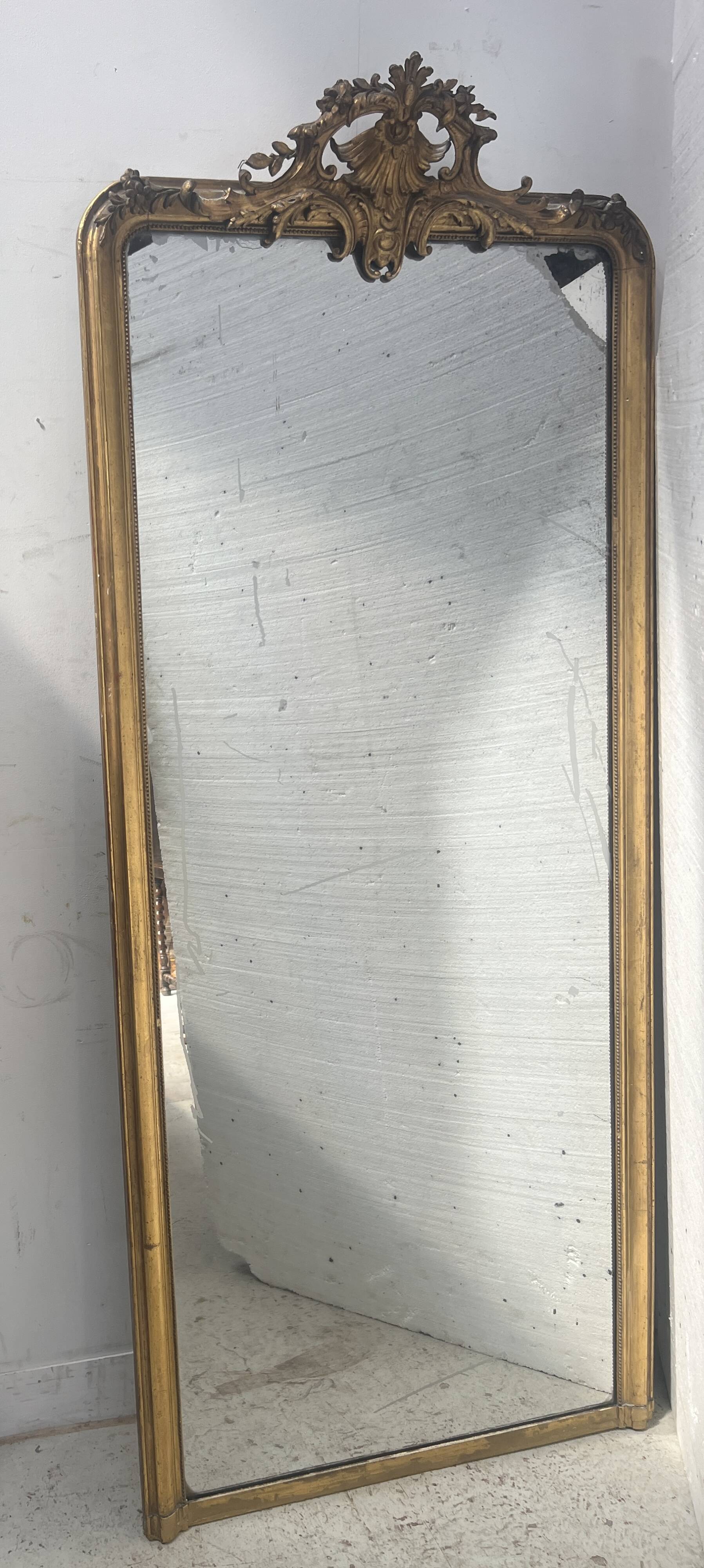 Louis XV style mirror in gilded wood and stucco
