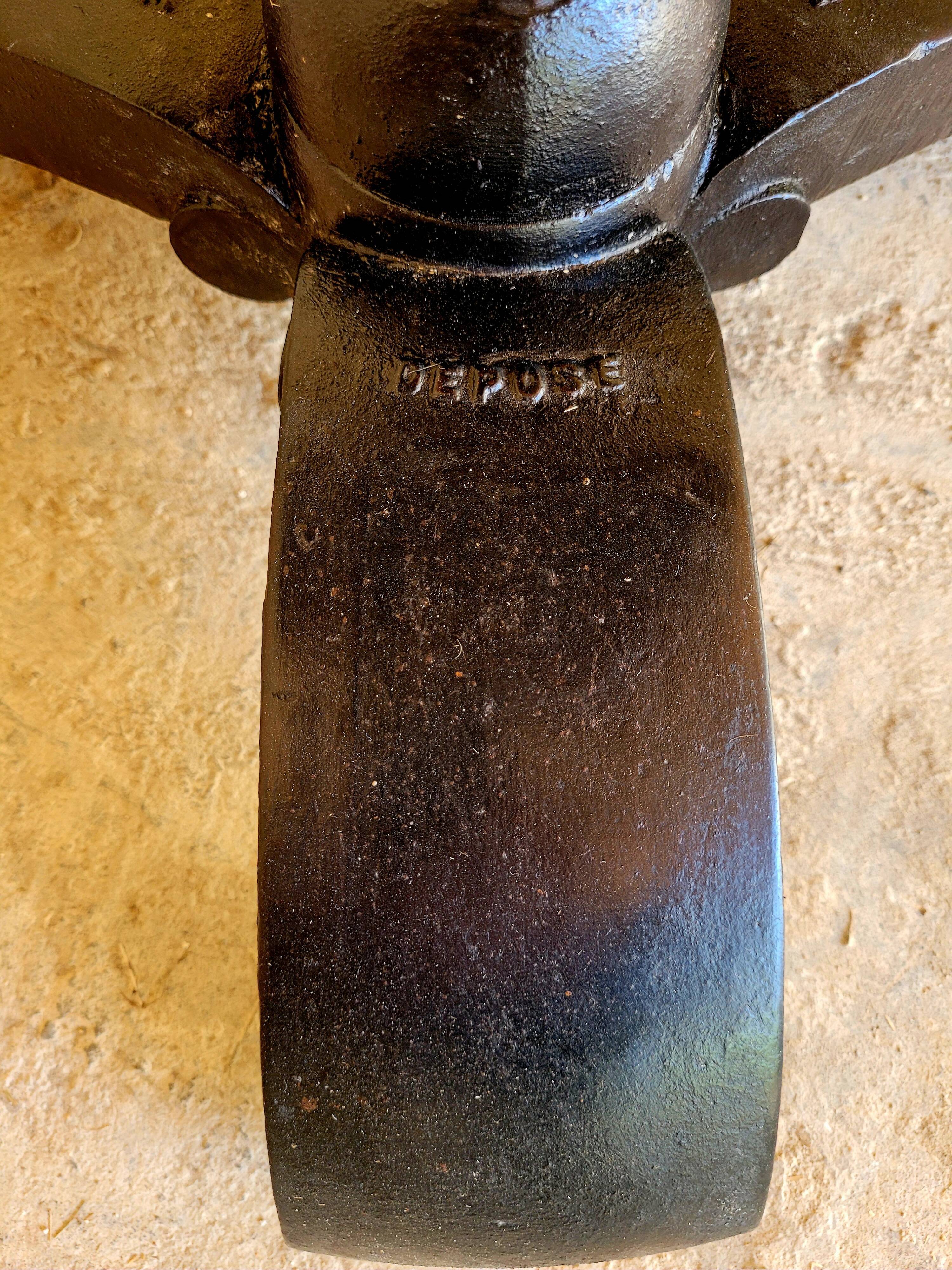 Old vintage bistro table brand Fischel in cast iron