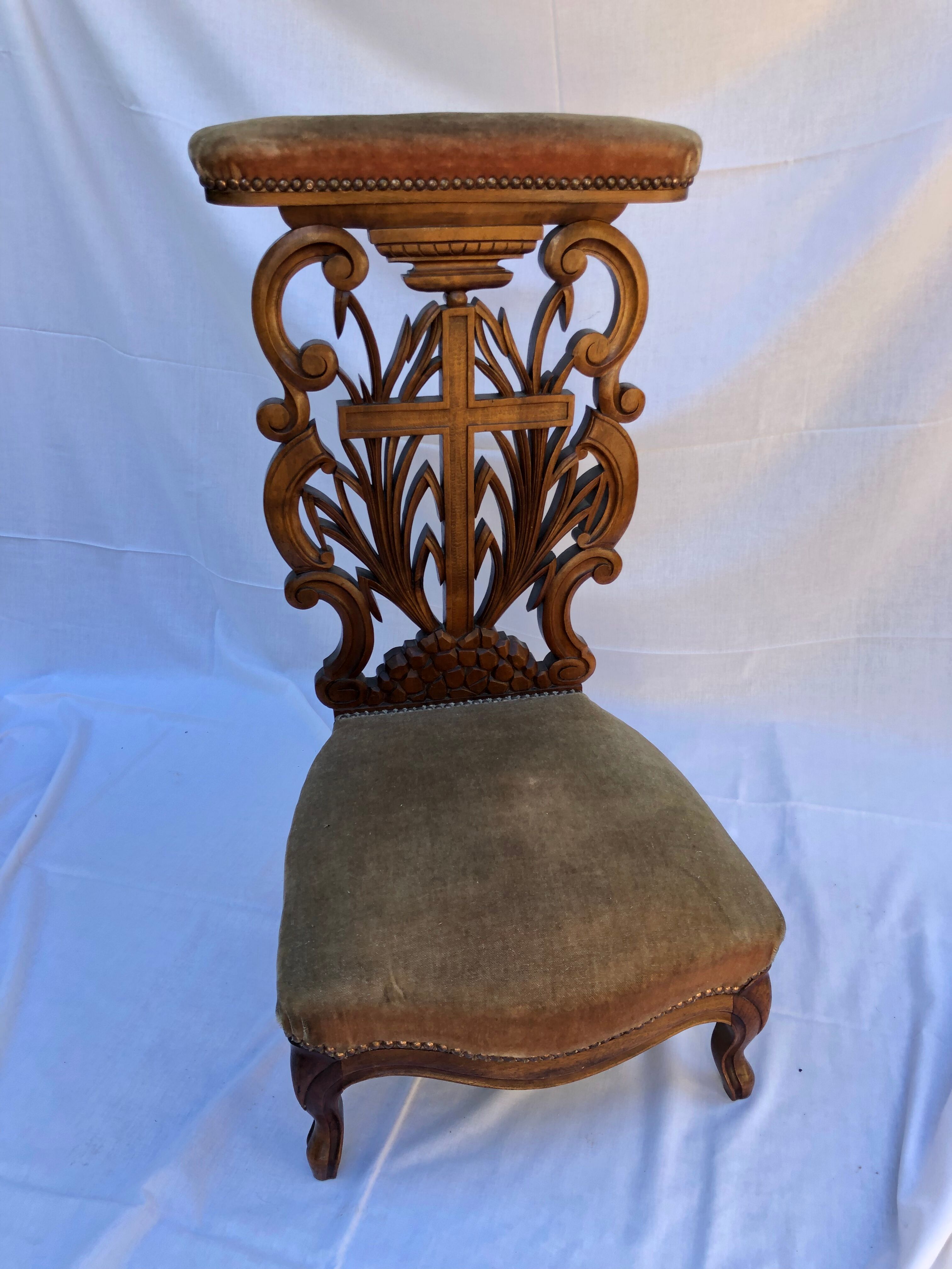 Low armchair in carved wood